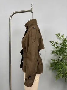 Side view of brown double-breasted short trench coat with waist belt
