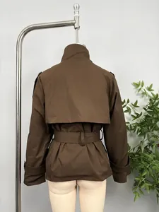 Back detail of a brown short trench coat featuring a belted waist and shoulder flap