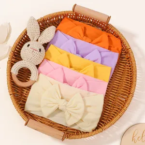 Set of 5 soft elastic nylon baby headbands with large bows in pastel colors for newborns