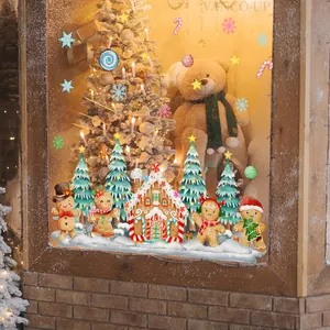 Festive Christmas window stickers featuring gingerbread men and a snowy house scene