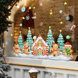 Festive Christmas gingerbread house and tree static window clings decoration on glass.