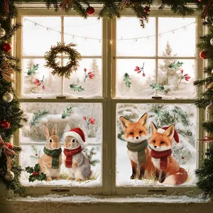 Christmas window stickers with cute fox and rabbit designs on snowy glass background.