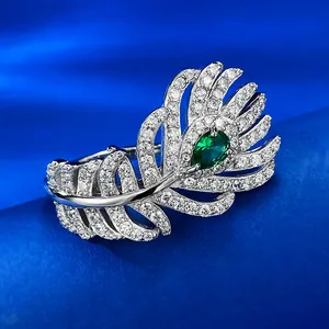 Detailed view of S925 silver peacock feather ring with green pear-cut gemstone