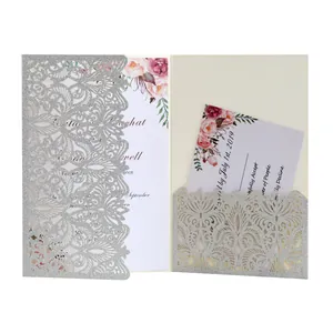 Laser-cut silver glitter wedding invitation card with elegant floral pattern