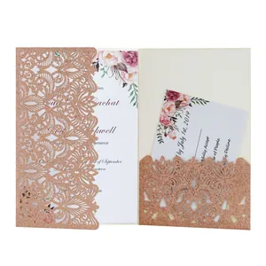 Detail of rose gold glitter laser-cut invitation with floral card and RSVP insert