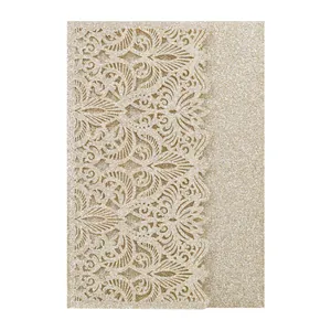 Detailed close-up of an elegant gold glitter laser-cut invitation card with floral pattern