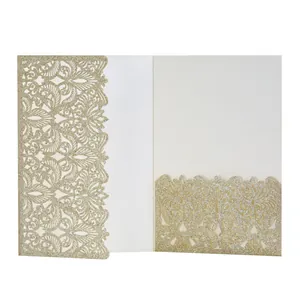 Detailed view of champagne gold laser cut glitter invitation card with lace pattern