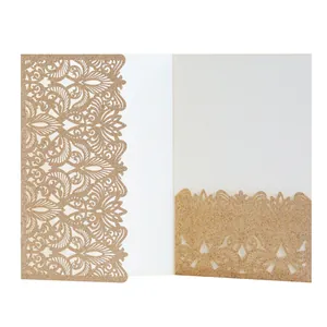 Detail of laser-cut gold glitter wedding invitation card with intricate hollow pattern