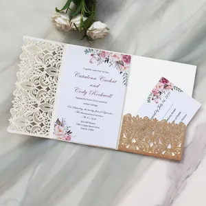 Detail of elegant laser cut wedding invitation with gold glitter and floral prints
