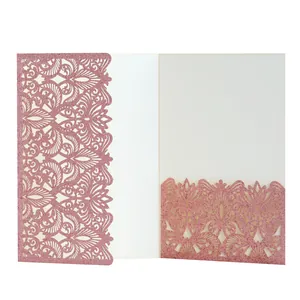 Detailed view of laser-cut rose gold glitter invitation pocket with filigree pattern