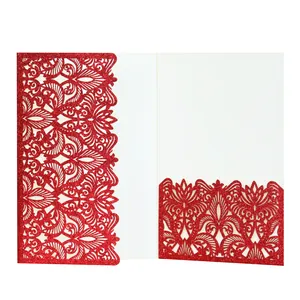 Detailed macro view of elegant red glitter laser-cut lace pattern on invitation card
