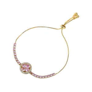 Elegant gold bracelet with rotating pink zircon flower and heart motif