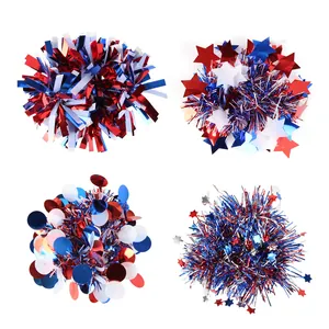 Detail view of four patriotic Independence Day wrist pom-poms with stars and ribbons.