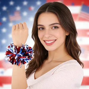 Close-up of patriotic red white and blue tinsel pom-pom wristband on model.