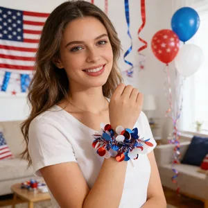 Close-up detail of a festive red, white, and blue Independence Day wrist corsage on a model
