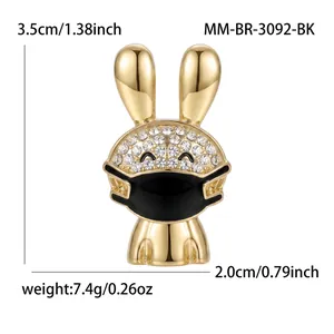 Detailed macro view of a cute golden masked rabbit brooch with size and weight info