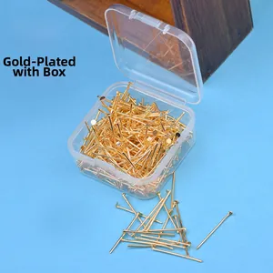 Detail view of gold-plated flat head pins for DIY earrings in a transparent storage box