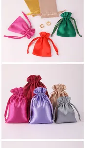 Variety of colorful satin drawstring gift bags for jewelry packaging with silk texture.