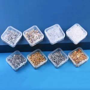 Close-up view of diverse earring backs and silicone stoppers in clear plastic boxes.