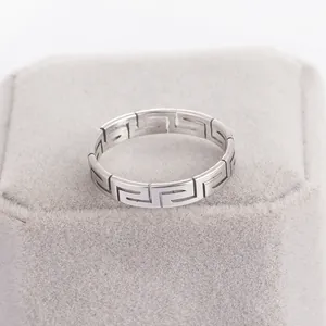 Minimalist stainless steel ring featuring a classic Greek key fret pattern