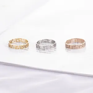 Minimalist stainless steel rings featuring a hollow Greek key pattern in three elegant colors