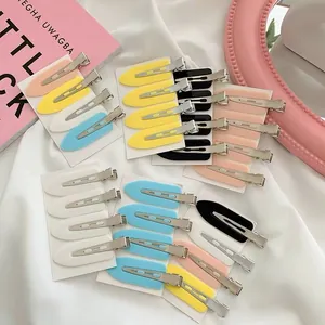 Close-up of colorful seamless flat hair clips in various macaron shades
