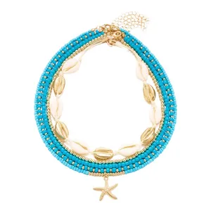 Bohemian multilayer necklace set with turquoise beads, cowrie shells and starfish pendant