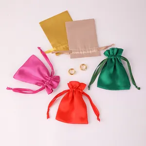Assorted colorful satin drawstring gift bags for jewelry packaging and storage