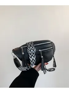 Black PU leather women's chest bag with tassel pendants and geometric wide strap