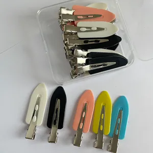 Detailed view of colorful seamless duckbill hair clips with transparent storage box