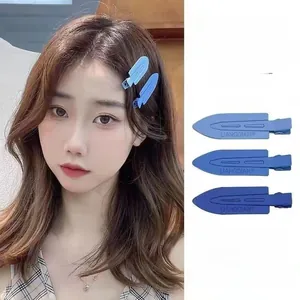 Blue seamless plastic duckbill hair clips for styling bangs, set of three shades.