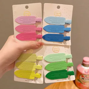 Close-up detail of colorful matte seamless hair clips set on white display cards