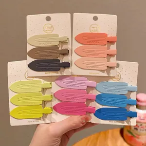 Detailed macro shot of colorful matte seamless plastic hair clips in assorted sets