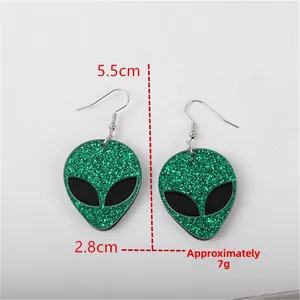 Detail view of green glitter alien earrings with 5.5cm and 2.8cm size annotations