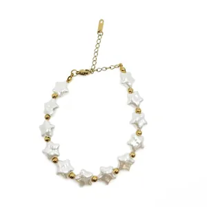 Detailed macro view of a star-shaped baroque pearl bracelet with elegant gold spacer beads