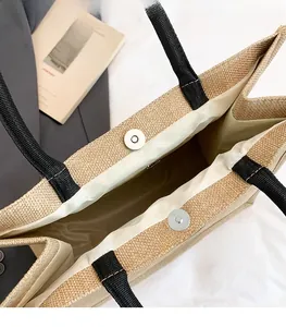 Detailed view of the jute tote bag interior featuring a magnetic snap closure.