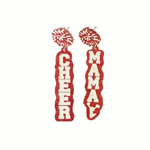 Detailed shot of red glitter acrylic earrings featuring white Cheer Mama text design