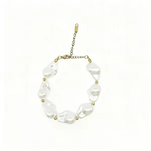 Detailed view of a baroque pearl bracelet with elegant golden spacer beads.