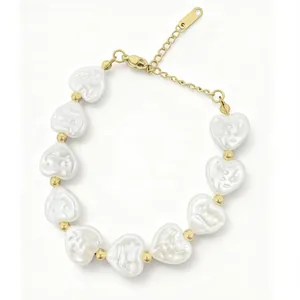 Detail of freshwater Baroque heart pearl bracelet with gold beads and lobster clasp