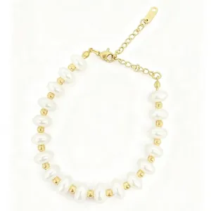 Elegant freshwater pearl bracelet featuring gold spacers and an adjustable lobster clasp chain