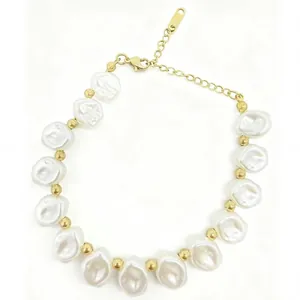 Macro view showing baroque irregular pearl bracelet with polished gold spacer beads