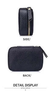 Detailansicht einer kleinen schwarzen Leder-Kosmetiktasche mit Gold-Reißverschluss.