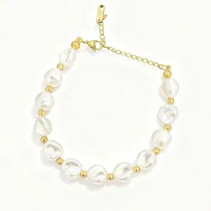 Elegant baroque freshwater pearl bracelet featuring gold spacer beads and secure clasp.