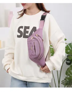 Close-up of purple quilted multi-layer fashion waist bag worn as a crossbody bag