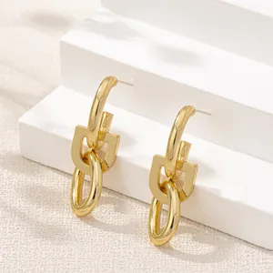 Elegant minimalist gold oval link drop earrings with a modern geometric U-shape design
