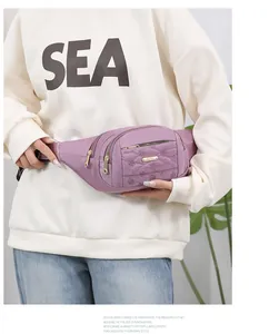 Stylish purple quilted multi-layer waist bag for women featuring elegant gold zippers