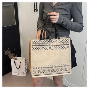 Fashionable large capacity jute tote bag with geometric print for commuting.