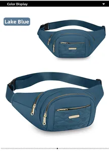 Macro view of a stylish lake blue multi-layer waist bag for women with gold zippers