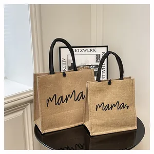 Eco-friendly yellow jute tote bag featuring stylish black 'mama' script print detail
