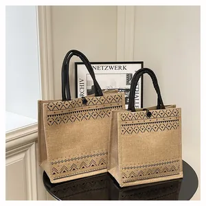 Stylish burlap tote bags with black geometric patterns shown in large and medium sizes